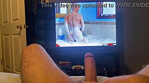 Masturbating to a hot porn video featuring a monster cock